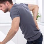 What causes bloody urine in men?
