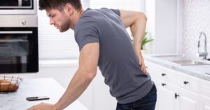 What causes bloody urine in men?